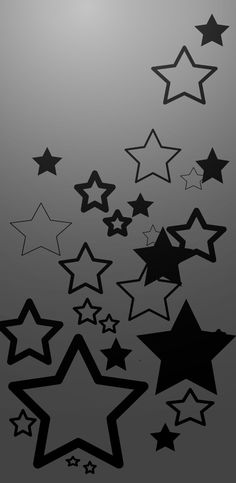 black and white stars are flying in the air