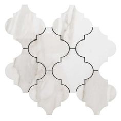 a white marble tile with black accents