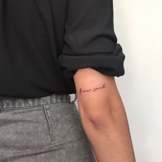 a person with a small tattoo on their arm