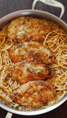 some chicken and noodles in a pan on a table