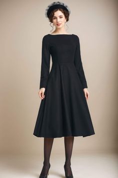 This gorgeous black fitted waist dress is perfect for the office or a night out! Wear with heels, sandals, tights or leggings and boots. Or dress it up with statement necklace and heels. This dress will fit in autumn season or winter. Details: * 35% wool blend, 35% fiber and polyester, 30% nylon * Polyester lining * Right side zipper * two side seam pockets *Midi dress, Long wool dress * boat neckline * long sleeves wool dress * A-line wool dress *Perfect for winter or autumn *Machine Washable in Warm/Cold Water/Do not bleach /Mid-iron /Hang Dry MODEL SIZE Height 170 cm (5′7″) Bust 80 cm (31.5") Waist 66 cm (26") She is wearing the black wool dress in size XS. CUSTOM ORDER Can't find your size in our size Chart Chang the Length Your Height is not Between 5'1" - 5"9" Your weight is not Betw Black Wool Dress For Formal Occasions, Black Wool Dress For Evening, Black Wool Evening Dress, Fitted Black Wool Dress, Black Fitted Wool Dress, Classic Black Winter Dress, Black Wool Dress For Winter, Black Wool Winter Dress, Black Wool Dress For Fall