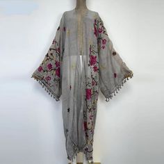 Spring Kimono With Tassels And Long Sleeves, Spring Long Sleeve Kimono With Tassels, Long Sleeve Kimono With Tassels For Spring, Summer Cotton Cardigan With Floral Embroidery, Long Cardigan With Tassels, Embroidered Open Front Cardigan, Embroidered Open Front Kimono For Fall, Embroidered Open Front Kimono For Festival, Casual Embroidered Kimono For Festival