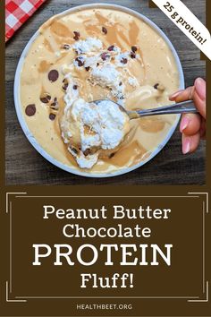 the peanut butter chocolate protein fluff is in a bowl with spoons on it