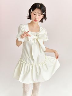 Composition : 100% cottonCountry of Origin : Republic of Korea Cotton Midi Dress With Ruffles And Short Sleeves, Square Neck Cotton Dress For Day Out, Cotton Puff Sleeve Dress With Ruffles For Day Out, Cotton Puff Sleeve Dress For Summer Day Out, Cotton Dress For Day Out With Short Sleeves, Cotton Dresses For Day Out With Short Sleeves, Feminine Knee-length Cotton Mini Dress, Short Sleeve Cotton Dress With Bow, Cotton Puff Sleeve Dress With Ruffles