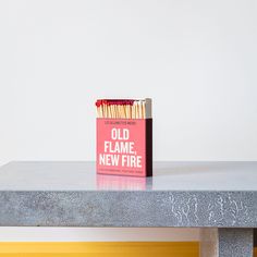 a box of matches sitting on top of a table