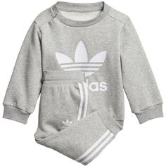 A cosy fleece track suit for little ones., This track suit is just like the grown-up version, but sized down for your smallest adidas fan. Cosy fleece feels soft and warm, and a big Trefoil on the sweatshirt and 3-Stripes down the pants add classic adidas style. Regular fit is not tight and not loose, the perfect in-between fit Ribbed crewneck Long sleeves; Ribbed cuffs Ribbed crewneck 3-Stripes tape on pants sides Button placket on shoulder for easy on and off (up to size 86); Drawcord on ribbe Cotton Sets With Ribbed Cuffs For Spring, Cotton Sports Sets With Long Sleeves, Cotton Long Sleeve Sports Sets, Sporty Cotton Long Sleeve Set, Fall White Crew Neck Sets, Casual Gray Long Sleeve Sets, White Long Sleeve Sports Sets, Casual Adidas Sets For Spring, Sporty Crew Neck Sets For Spring