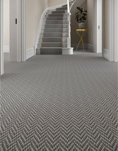 a staircase and carpet in a house