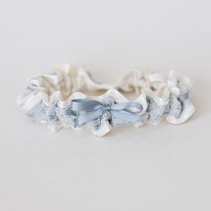 Designed to love forever and ready for you! The 'Just Say Yes' collection of wedding garter heirlooms are stylishly designed and expertly handcrafted - just in time for your wedding. Perfect for those "I totally forgot about this until the last minute" wedding planning or bridal shower moments. (We've all been there!) NEW! Personalize your "Just Say Yes" style by adding hand embroidery. After you choose your favorite style, don't forget to add embroidery to your heirloom. Click here to see weddi Adjustable Lace Bridal Accessories For Ceremony, Adjustable Bridal Accessories For Ceremony, Adjustable Cream Bridal Accessories As Gift, Satin Background, Bride Garter, Wedding Garter Blue, Bridal Garter Lace, Blue White Weddings, Wedding Garter Lace