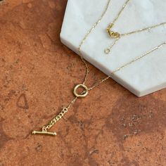 14KT Yellow Gold Polished Drop Toggle Necklace Chain + 1in Extender "Y" Chain 18.5 in Adjustable in Length w toggle   Lariat Style/ "Y" 14KT Yellow Gold Lobster Clasp Weight: 3.52 grams Stamped 14K Solid 14K Italy Made 1 Inch extender Cable + Curb chain  Designer appeal! Light, airy look! Great way to update your jewelry wardrobe for less.. Please check out our other jewelry items. Let us know if you have any questions.  Thank you, Legacy Saint Jewelry Classic Lariat Necklace With Adjustable Chain, Adjustable Round Lariat Necklace With Delicate Chain, Adjustable Delicate Chain Lariat Necklace, Classic Lariat Necklace Gift, Classic Lariat Necklace For Gifts, Gold Lariat Necklace With Lobster Clasp, Classic Round Toggle Necklace With Adjustable Chain, Classic Lariat Clavicle Chain Necklace, Classic Toggle Necklace With Adjustable Chain