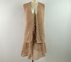 "Vintage 1970s skirt suit, vest top and skirt. Made of off beige crochet cotton/poly. vest has no closures, worn open. Skirt has an internal cinches cord for waist size adjustment. No labels, about a size medium. Actual measurements are: top: 38\" at the bust 40\" at the waist 28\" overall length Skirt: 32\" waist, uncinched will fit smaller 46\" hips 24\" overall length In very good condition." Crochet Suit, 1970s Skirt, 1970s Crochet, Open Skirt, Crochet Outfit, Shirt And Skirt, Beige Crochet, Suit Vintage, Army Pants