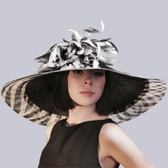 Elegant Derby Hat Black&White Wide Brim Headwear This elegant Wide Brim Derby Hat looks amazingly stunning and ideally accessorizes a multitude of your apparel. Whether you choose a classical dress or a modern and stylish outfit for the upcoming event, this derby hat will surely bring out the magnetism and charisma you are looking for.  * Handmade;  * 57cm(22,4 inches)-59cm(23,23 inches)sizes;  * Created using high-quality handwoven para sisal straw;  * The interior is trimmed with grosgrain rib Modern Fitted Hats For Spring, Luxury Black Hat For Spring, Modern Black Hats For Spring, Modern Black Spring Hats, Luxury White Hats For Spring, Luxury Fitted White Hat, Chic Fitted White Hat, Chic White Fitted Hat, Luxury Black Summer Hats