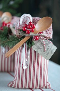 two small gift bags with spoons in them