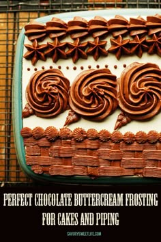 a cake with chocolate icing and swirls is on a cooling rack in front of a brick wall