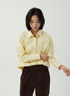 Product Detail Style : Casual Occasion : Work wear Print : Solid Material : Cotton Sleeve : Long sleeve Neck : Collar Length : Regular Fit : Normal fit Cotton 100 Model Size Height : 165cm / Top : S / Bottom : S(25 inch) .prddescription table, .prddescription td, .prddescription th { border : 1px solid black; border-collapse : collapse; padding: 10px; } Size(Inch) Size Shoulder Bust Sleeve Length Armhole Sleeve Width Sleeve Hem Neck width Hem Total Length S/M 19.5" 21.3" 21.1" 9.1" 7.7" 3.7" 5.9 Button Shirt, Neck Collar, Body Size, Track Pants, Solid Black, Yellow White, Green And Grey, Work Wear, Shirt Blouses