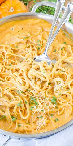 a large pot filled with pasta and garnished with parsley