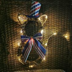 a lighted mickey mouse head is on display in front of a rat ears wall decoration