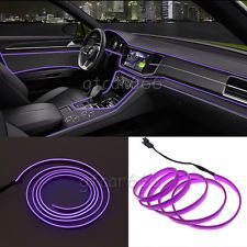 the interior of a car is shown with purple neon lights and steering wheel rings on it