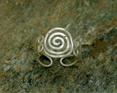 "✧ Spiral open ring in Sterling silver by BIOS jewelry ✧ ◆ This Spiral ring radiates its high quality craftsmanship made completely by hand using sterling silver wire in our workshop in Greece ◆ It features the Spiral motif, one of the oldest and most popular symbols worldwide. ◆ A symbol that appears frequently in nature and in ancient civilizations from the ancient Celts to Greeks and Native Americans as well. ◆ Our designs focus mainly on the Archimedean spiral ( or arithmetic spiral) design. Handmade Sterling Silver Spiral Rings, Nickel-free Silver Spiral Rings, Nickel-free Spiral Silver Rings, Handmade Silver Spiral Ring, Hand Forged Spiral Rings For Gifts, Hand Forged Spiral Ring For Gift, Hand Forged Silver Spiral Rings, Hand Forged Spiral Ring As Gift, Hand Forged Spiral Ring