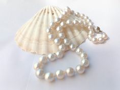 NB: THIS ITEM DOES NOT SHIP TO GERMANY Listing: Awesome 48cm silver white South Sea real pearl strand. #70  Color:  Silver white Length: 48cm (19 inches) Shape:  Near round Size: 8mm - 10mm width Enhancement: Nil Clasp: Fancy 925 silver ball clasp Pearl info:  Cultured. Natural color. Luster: Good Nacre:  Good Body:  Good with few natural organic spots. Packaging:   PLEASE NOTE. Read POLICIES and SHIPPING INFORMATION. Classic White Single Strand Pearl Necklace, Classic White Pearl Drop Necklace, Classic White Pearl Necklace With Pearl Drop, White Pearl Necklace With Sterling Silver Clasp For Anniversary, White Akoya Pearl Necklace With Sterling Silver Clasp, Classic White Pearl Necklace With Pendant, Formal White Single Strand Pearl Necklace, White Pearl Necklaces With Sterling Silver Clasp, Classic White Pearl Necklace For Anniversary