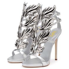 Elevate your evening look with these metallic silver strappy-heeled sandals. Featuring an open-toe and adjustable buckle strap design, these shoes add a touch of glamour and sophistication to any outfit. Color: Silver Material: Metallic finish Heel type: Stiletto Heel Heel height: 4.72" / 120 mm approx Product measurements were taken using size 8. Please note that measurements may vary by size. Toe: Open toe Adjustable buckle strap design Handcrafted US sizing. Fits true to size. Music Festival Shoes, Silver Evening Shoes, Silver Evening Dress, Platform Pumps Heels, Festival Shoes, Giuseppe Zanotti Heels, Custom Boots, Prom Heels, Silver Sandals