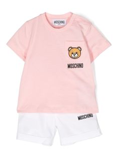 pink/white cotton signature Teddy Bear embroidery to the front embroidered logo to the front Top: soft jersey crew neck short sleeves chest patch pocket press-stud fastening at the shoulder straight hem unlined Shorts: poplin texture logo-engraved buttons belt loops two rounded pockets to the sides two rear patch pockets elasticated waistband front button fastening turn-up hem unlined Sporty Cotton Set With Pockets, Sporty Cotton Sets With Pockets, Pink Cotton Sets With Pockets, Pink Cotton Top With Logo Detail, Cotton T-shirt With Side Pockets For Loungewear, Casual Cotton Sets With Logo Print, Pink Cotton T-shirt With Pockets, Kids Teddy Bear, Moschino Kids