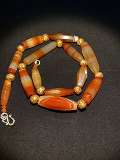 A beautiful faceted cut red carnelian agate beads necklace Antique carnelian agate beads made in Germany Idar Oberstein in the late 1800's They were used as trade beads in African trade in late 1800's some Gold plated wax beads are used as counter beads we provide fast and free shipping by which can get the items by maximum 7 working days Elegant Faceted Carnelian Necklace, Formal Handmade Carnelian Necklaces, Antique Carnelian Necklaces With Natural Stones, Antique Carnelian Necklace With Natural Stones, Formal Orange Carnelian Necklace, Oval Carnelian Necklace With Natural Stones, Orange Faceted Carnelian Necklace, Orange Faceted Carnelian Necklaces, Elegant Hand-strung Carnelian Beads