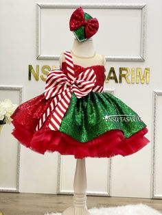 Introducing Our Enchanting Christmas Holiday Dress for Girls The magic of the holiday season comes to life with our exquisite knee-length, flared Christmas holiday dress specially designed for your little princess. Make this festive season unforgettable with this delightful creation. This Christmas holiday dress is a vision of yuletide joy, featuring a rich red and green sequined fabric. The vibrant colors, paired with its sleeveless design, ensure your child will look and feel like the belle of Green Christmas Princess Dress For Dress-up, Sleeveless Christmas Princess Dress, Sleeveless Princess Dress For Christmas, Christmas Pageant Sleeveless Tutu Dress, Sleeveless Holiday Princess Dress For Festive Occasions, Fitted Sleeveless Princess Dress For Christmas, Green Christmas Pageant Dress, Red Princess Dress For Christmas Dress-up, Christmas Pageant Sleeveless Holiday Dress