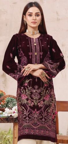 It is a beautiful ready to wear kurta for women. It is available in 2 sizes. Small  Chest 38 inches all around, waist 38, hips 42 and length 39 inches. Large Chest 45 inches all around, waist 44, hips 46 and length 39 inches. This is a beautiful fully embroided kurta with tilla thread embroidery, sequins and tussles on it. It is just a kurta no pants with this . The fabric is velvet which is very soft and lightweight. Color dark purple. No return or exchange please. Bollywood Style Dabka Work Tunic, Elegant Tunic With Zari Work For Eid, Elegant Eid Tunic With Zari Work, Festive Dabka Work Tunic, Designer Long Sleeve Tunic With Dupatta, Semi-stitched Long Sleeve Salwar Kameez, Eid Tunic With Zari Work, Long Sleeve Semi-stitched Salwar Kameez, Elegant Festive Tunic With Dabka Work