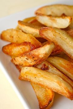 french fries on a plate with ketchup and mustard