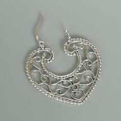 Indian style sterling silver filigree ear hoops. Dimensions: 31.5 x 33 mm weight: 5.8gm Price listed is for ONE PAIR These are made of 925 hypoallergenic sterling silver. Most of my pieces come with a 925 stamp. Can be packaged in a gift box. I can include a personal message from you if needed You are welcome to contact me at... bhavnakwintra1956@gmail.com For more beautiful pieces from my shop, please browse 👇 TOE RINGS: https://www.etsy.com/your/shops/TheSilverGame/tools/listings/section:2702 Silver Filigree Small Hoop Jewelry, Bohemian Sterling Silver Heart Earrings, Silver Single Heart Earring, Silver Heart Single Earring, Silver Sterling Silver Hoop Earrings With Filigree, Nickel Free Small Hoop Silver Heart Earrings, Nickel Free Silver Hoop Heart Earrings, Nickel-free Small Hoop Heart Earrings In Silver, Silver Nickel-free Hoop Heart Earrings