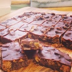 chocolate bars cut into squares and stacked on top of each other, ready to be eaten