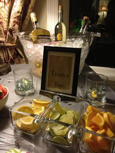 a table topped with lots of fruit and drinks