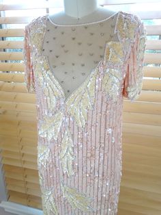 "This is an absolutely gorgeous gown. It's very intricately embellished with pink pearl beading and iridescent pink sequins. It's in good vintage condition. Size SMALL Measurements: Bust - 34/36\" Waist - 34/36\" Hips - 34/36\" Length - 57\" Size - Small Size LARGE Measurements: Bust - 42/44\" Waist - 42/44\" Hips - 42/44\" Length - 59\" Size - Large This dress comes from a pet-free and smoke-free home. If you would like more info or have any questions, please don't hesitate to ask!" Pink Sequin Formal Dress, Vintage Party Dresses With Pearl Embroidery, Vintage Pearl Embroidery Party Dress, Glamorous Pink Pearl Embroidered Dress, Vintage Sequin Dress For Wedding, Vintage Pink Sequined Dresses, Vintage Pink Sequin Dress, Pink Vintage Sequin Dress, Festive Pink Sequined Evening Dress