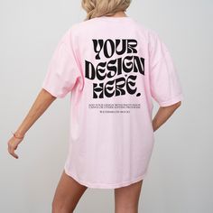 a woman wearing a pink t - shirt with the words your design here printed on it