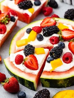 slices of fruit pizza with whipped cream and fresh berries on the top are ready to be eaten