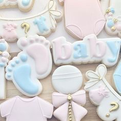 baby shower cookies are arranged on a table