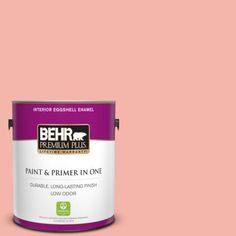 a can of behr premium plus paint and primer in one on a blue background