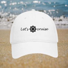 Are you planning a cruise trip? Don't forget to pack a hat! A hat can protect you from the sun, keep you cool, and add some style to your outfit.  100% cotton twill, soft and unstructured 6 panel low-fitting dad hat. One size fit most adult, Garment Washed Pigment Dyed Cotton Twill. Set sail in style with this "Let's Cruise" embroidered white baseball cap, featuring a nautical wheel design! Perfect for cruise enthusiasts and boat lovers, this adjustable distressed hat adds a touch of maritime flair to any outfit. Whether you're on the deck or dreaming of the sea, this cap is a must-have accessory. ⚓🧢 "Let's Cruise" embroidered design with nautical wheel Distressed detailing for a stylish, lived-in look Adjustable strap for a perfect, comfortable fit Ideal for cruise trips, boat lovers, or White Nautical Cap, White Travel Hat For Beach Season, White Hat For Beach Season Travel, White Beach Hat For Travel, Summer Snapback Hat For Travel, White Sun Hat For Travel, One Size Fits Most, White Travel Sun Hat, One Size Fits Most, White Travel Sun Hat, One Size, White Travel Sun Hat One Size Fits Most