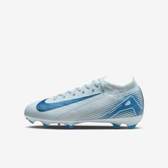 a white and blue nike soccer shoe on a white background with the word nike written in blue