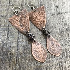 Nature-inspired Silver Copper Earrings, Copper Oxidized Finish Drop Earrings, Rustic Handmade Teardrop Earrings, Artisan Etched Drop Earrings, Rustic Adjustable Etched Jewelry, Unique Soldered Drop Earrings, Rustic Hand Forged Earrings For Gift, Artistic Teardrop Soldered Earrings, Hand Forged Bronze Rustic Earrings