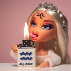 a barbie doll blowing out a lighter with the word aquarius on it's side