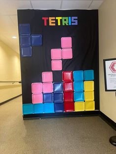 a colorful tetris game on display in an office hallway