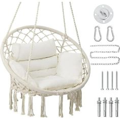 a white hanging chair with pillows and chains next to some screws, nails and hooks