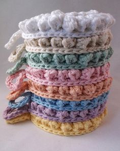 a stack of crocheted washcloths sitting on top of each other