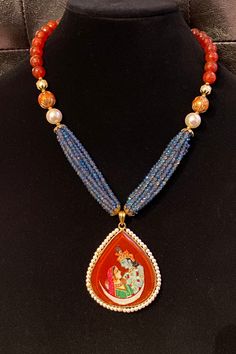 This is definitely a rare gem! A beautiful hand painted Radha Krishna pendant on an elegant necklace made of semi precious stones, pearls and pure iridescent crystals! Designed for all lovers of Lord Krishna! Spiritual Pearl Beaded Necklace With Gemstone, Mother Of Pearl Necklace With Gemstone Beads As Gift, Fusion Style Beaded Necklaces For Gifts, Festival Pearl Pendant Necklace Gift, Spiritual Crystal Beaded Necklaces As Gift, Spiritual Crystal Beaded Necklace For Gift, Spiritual Crystal Beaded Necklaces For Gifts, Mother Of Pearl Jewelry With Polished Beads For Gifts, Gift Mother Of Pearl Beaded Necklaces With Polished Beads