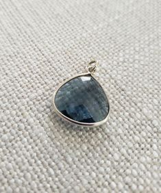 midnight blue quartz teadrop shaped charm. Sterling silver bezel and jump ring. Jump ring size 3.5mm inner circle  Gemstone Size approx. 19x17mm Silver Faceted Teardrop Pendant Jewelry, Silver Teardrop Pendant Jewelry With Bezel Setting, Teardrop Sapphire Faceted Jewelry, Faceted Teardrop Sapphire Jewelry, Sterling Silver Teardrop Charms Jewelry, Silver Teardrop Faceted Jewelry, Silver Faceted Teardrop Jewelry, Sapphire Drop Birthstone Jewelry, Sapphire Drop Jewelry For Birthstone