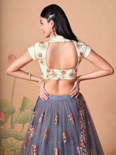 Perfectly pretty and eye-catchy gracefully adorned with this attractive grey color lehenga is formed with net material designed with mirror work, thread embroidery, and sequin work. This grey lehenga arrives with a ivory color art silk material choli made with embroidery and mirror work. It also comes with a grey color net material dupatta created with thread embroidery and sequin work. This grey lehenga is stitched and can be customized up to 42 inches. The choli will be fully stitched material Fitted Anarkali Net Blouse, Fitted Anarkali Blouse In Net, Fitted Anarkali Net Choli, Festive Gray Zari Work Sets, Gray Anarkali Set With Dupatta, Gray Anarkali Set With Zari Work, Gray Anarkali Set For Festive Occasions, Fitted Net Choli With Pallu, Fitted Net Choli For Navratri