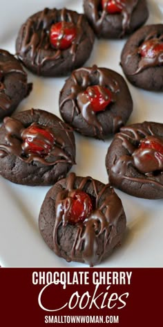 chocolate cookies with cherries on a white plate