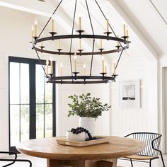 a chandelier hanging from the ceiling in a dining room