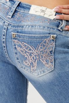 Low-rise, light-wash slim bootcut jeans- Butterfly design in pink and silver embroidery with matching yoke design- Mini silver rhinestone rivets throughout design- White leather logo brand patch- Rhinestone rivets- 5-pocket design- Slight fading Model is wearing size: 26Model Measurements:Height: 5'8"Bust: 35"Waist: 26"Hips: 39" Fabric Content: 52% Cotton, 27% Lyocell, 20% Polyester, 1% Elastane Care: Gentle machine wash inside-out with like colors in cold water. Tumble dry low. Style No. L9330S Luxury Medium Wash Flare Jeans With Patch Pockets, Luxury Washed Blue Flare Jeans With Five Pockets, Luxury Faded Flare Jeans With Pockets, Luxury Faded Denim Flare Jeans, Cheap Vintage Cutoff Jeans, Luxury Medium Wash Flare Jeans For Summer, Luxury Denim Blue Flare Jeans For Women, Cheap Fitted Light Wash Flare Jeans, Luxury Women's Jeans With Flap Pockets